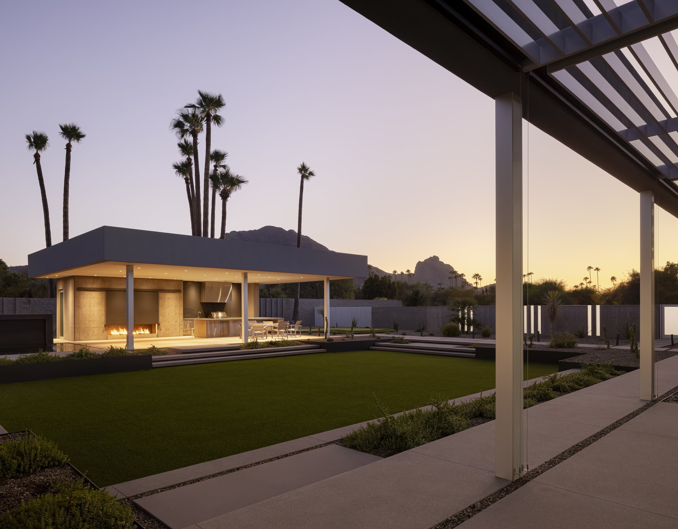 The White Wing residence at dusk beneath its louvered canopy